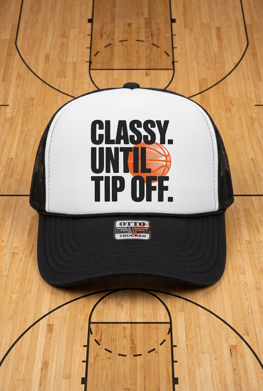 A black and white trucker hat with a white front panel featuring the text 'CLASSY. UNTIL TIP OFF.