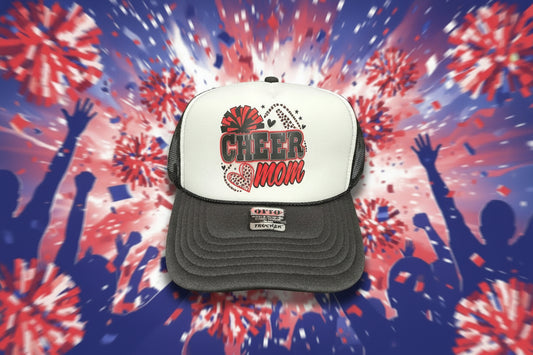 A white and black trucker hat with a 'CHEER mom' graphic on the front.
