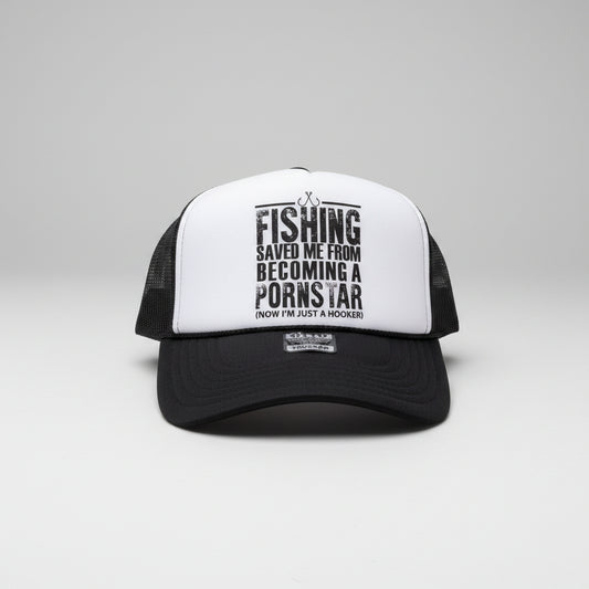 A black and white trucker hat with a red mesh back, featuring a bold black text graphic on the white front panel that reads 'FISHING SAVED ME FROM BECOMING A PORN STAR (NOW I'M JUST A HOOKER)'.