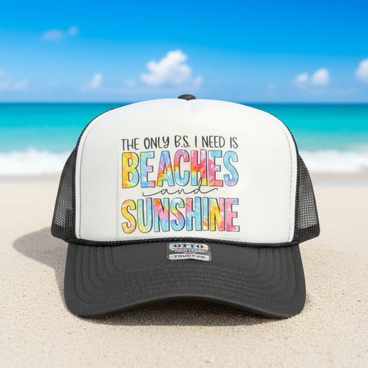 A gray and white trucker hat with a colorful graphic that reads 'THE ONLY B.S.