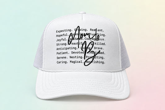 A white trucker-style baseball cap with black printed text on the front and a large black autograph across the center. The brim also has an Otto Trucker label.