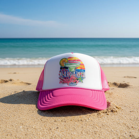 A pink and white trucker hat with a colorful 'Margarita Weather' graphic on the front panel and an OTTO brand sticker on the brim.